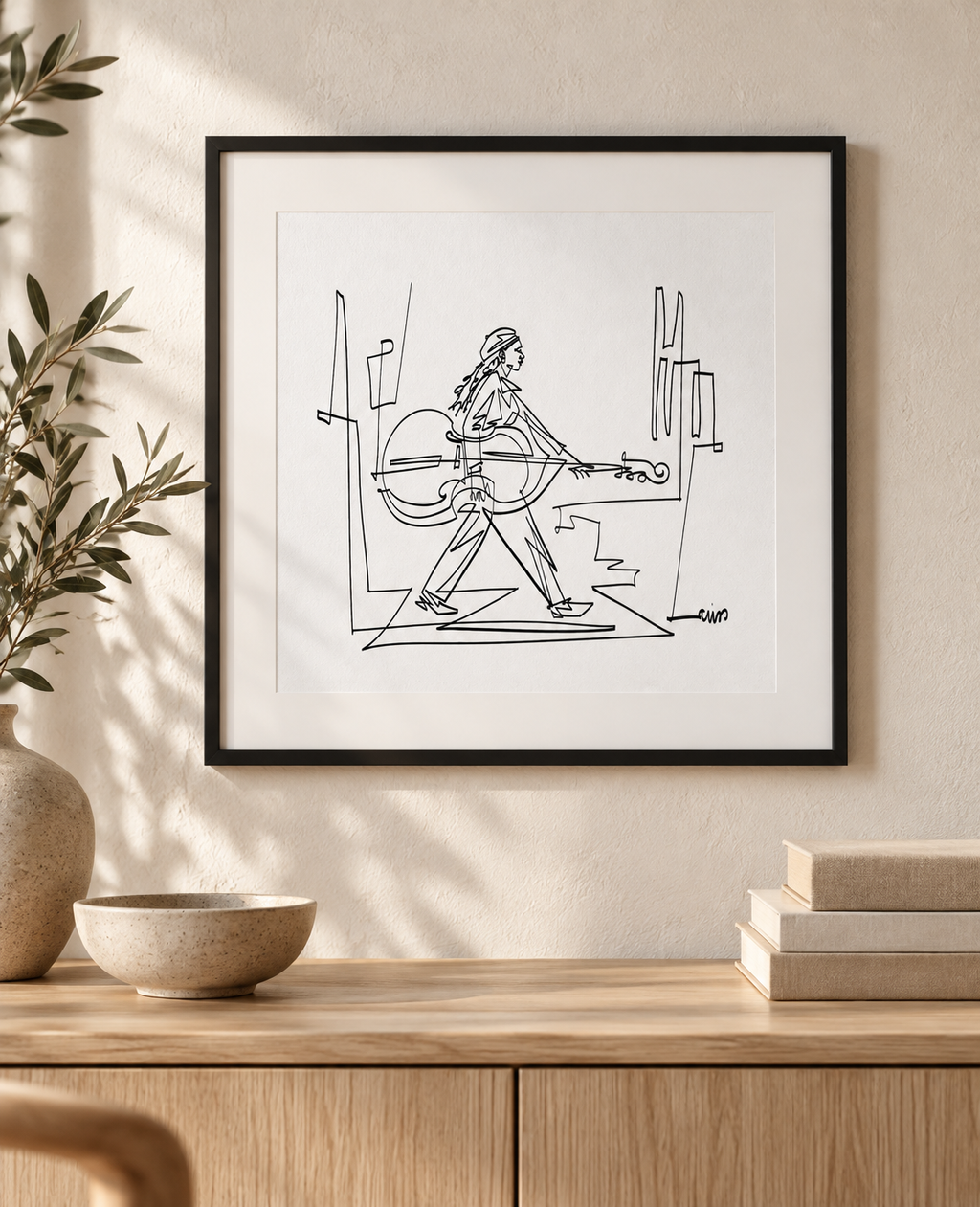 Crossing with a Cello art print in a square black frame with white mat above an oak console. Illustrative interior; frame and mat not included.