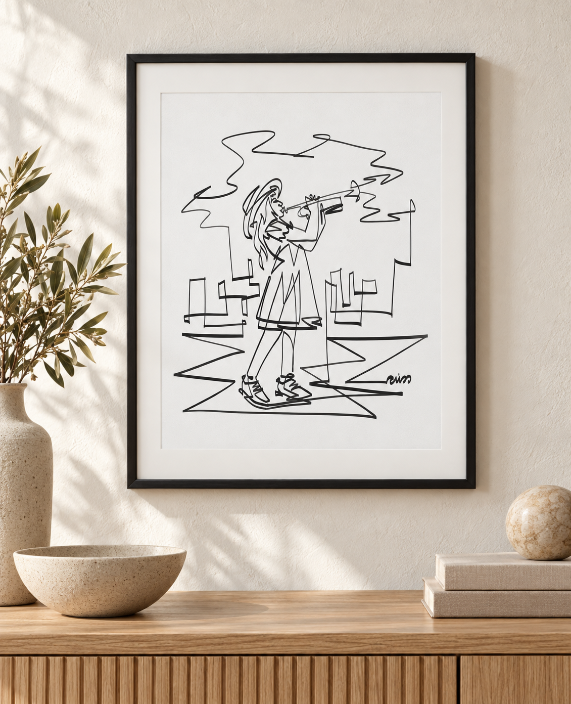 Girl Playing Trumpet art print in a black frame with white mat above an oak console. Illustrative interior; frame and mat not included.