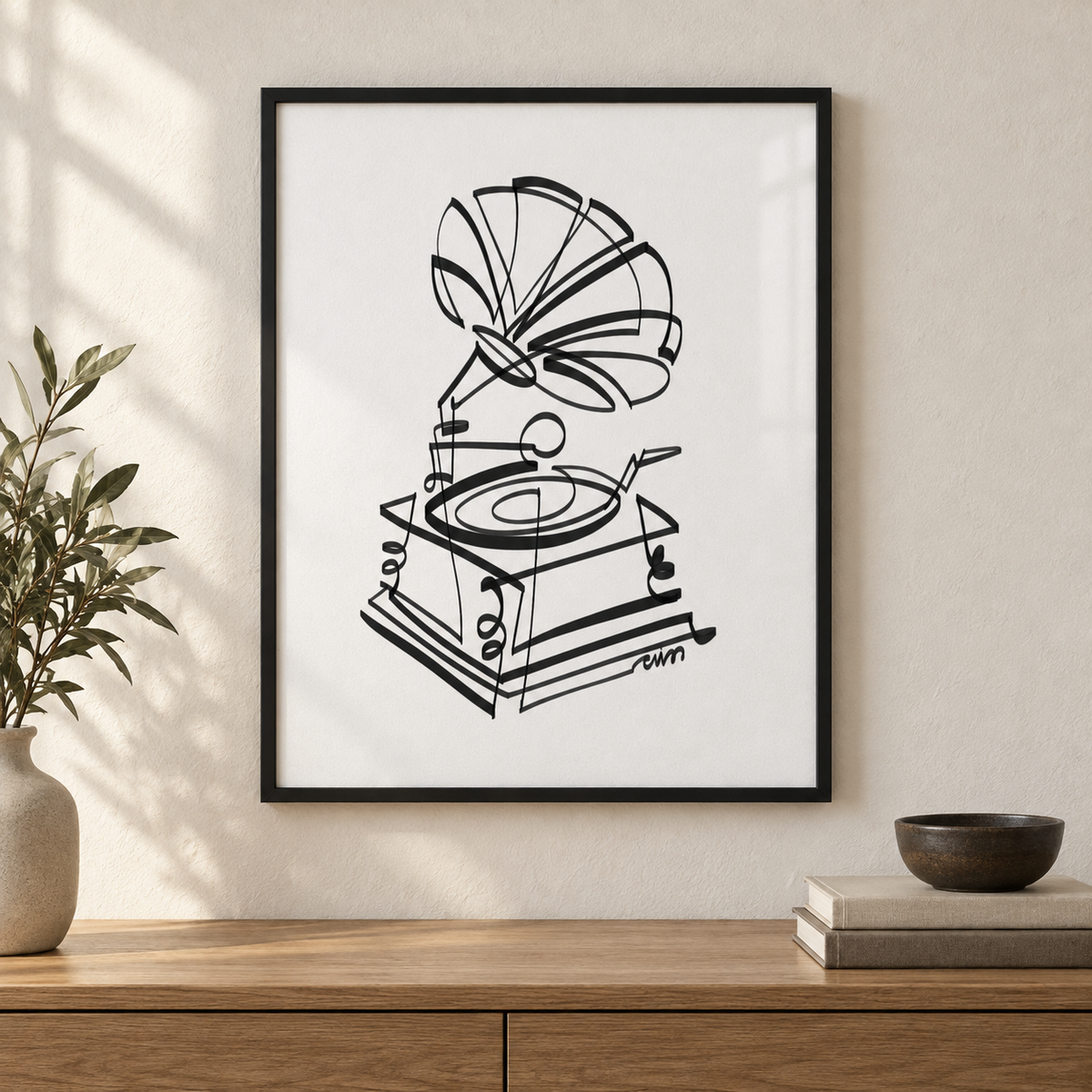 Gramophone art print by Cris D. in a slim black frame above an oak console. Illustrative interior; frame not included.