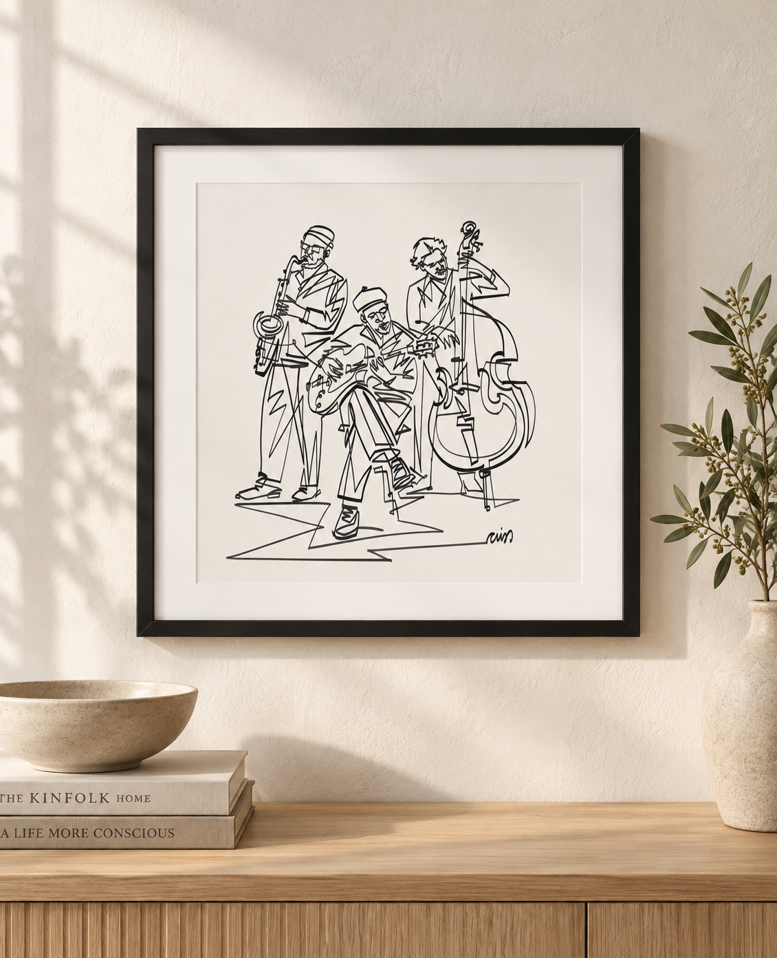 Jazz Trio: Single Line print in a square black frame with white mat above an oak console. Illustrative interior; frame and mat not included.