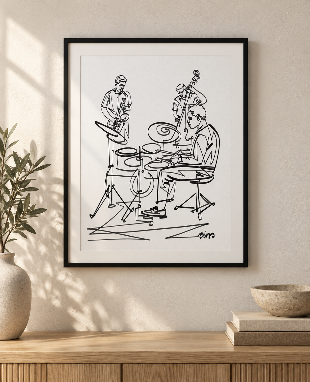 Jazz Trio: Continuous Line print in a black frame with white mat above an oak console. Illustrative interior; frame and mat not included.